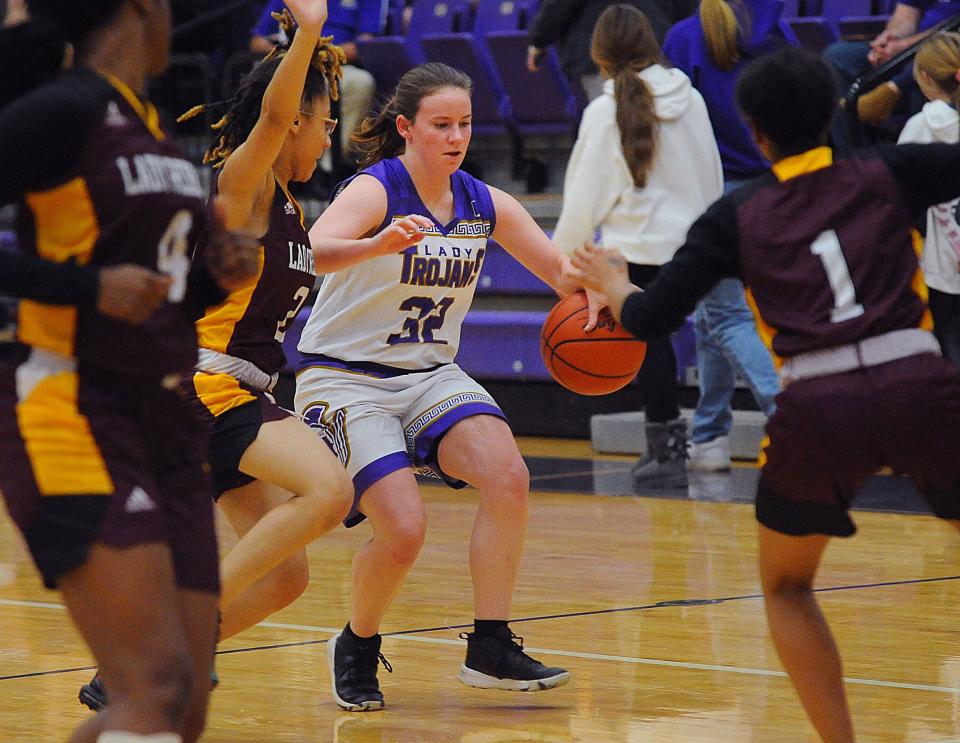 Sebring McKinley's Kiera Weekly handles the ball against a full court press during a non-conference game against visiting Cleveland John Adams Monday, November 28, 2022.