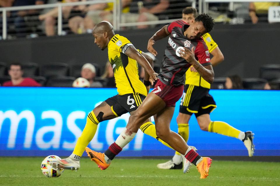 Jul 6, 2024; Columbus, OH, USA; Columbus Crew midfielder Darlington Nagbe (6) makes contact with Toronto FC midfielder Kosi Thompson (47) during the second half of the MLS soccer match at Lower.com Field. The Crew won 4-0.