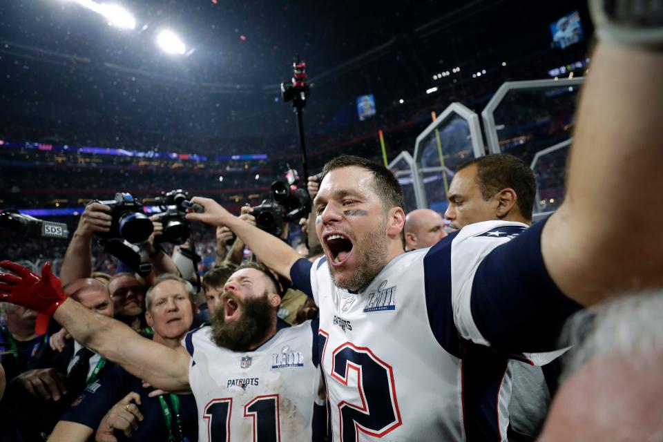 New England Patriots' Julian Edelman, left, and Tom Brady celebrate after the NFL Super Bowl 53 football game against the Los Angeles Rams, Sunday, Feb. 3, 2019, in Atlanta. The Patriots won 13-3. Edelman was named the Most Valuable Player.