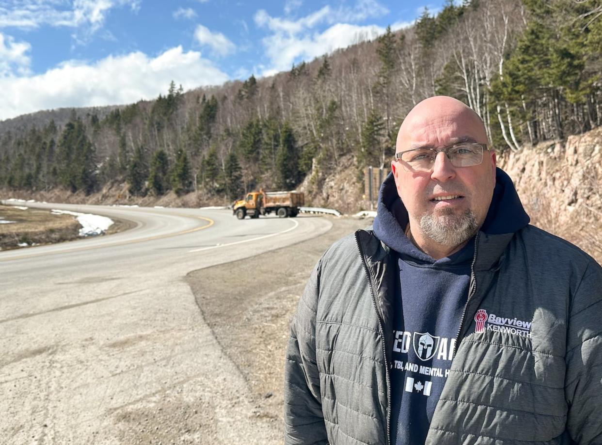 Truck driver Troy Arsenault is thankful no one was hurt when his tanker overturned on Highway 105 going over Kellys Mountain early Monday morning. (Tom Ayers/CBC - image credit)