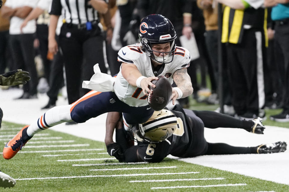 Chicago Bears quarterback Tyson Bagent (17) lunges as he tries for a first down while New Orleans Saints safety Marcus Maye (6) defends during the first half of an NFL football game in New Orleans, Sunday, Nov. 5, 2023. (AP Photo/Gerald Herbert)