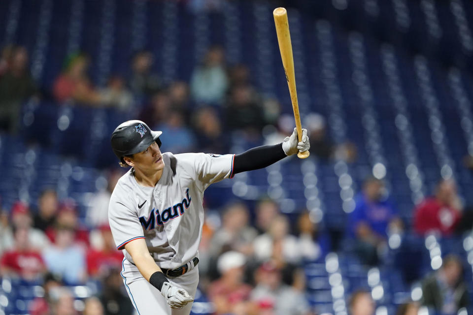 Miami Marlins' Brian Anderson follows through after hitting an RBI-sacrifice fly against Philadelphia Phillies pitcher Brad Hand during the eighth inning of a baseball game, Tuesday, Sept. 6, 2022, in Philadelphia. (AP Photo/Matt Slocum)