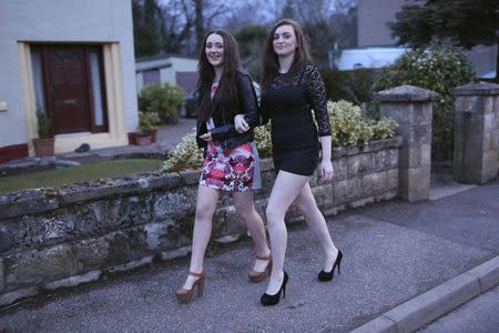 Yasmin Gray (L), 16, and Leonie Matthews, who will be 16 at time of the vote, pose for a photograph while getting ready to go to a friend's 16th birthday party in Nairn, Invernesshire March 8, 2014. REUTERS/Paul Hackett