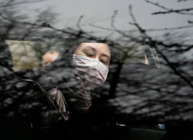 Huawei executive Meng Wanzhou leaves for B.C. Supreme Court hearings during the first week of March 2021. Her lawyers claim former U.S. President Donald Trump threatened to use her as a bargaining chip in a trade war with China.  (Jonathan Hayward/Canadian Press - image credit)