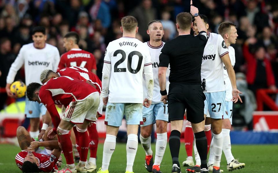 West Ham United's Kalvin Phillips reacts after being shown a red card by referee Thomas Bramall