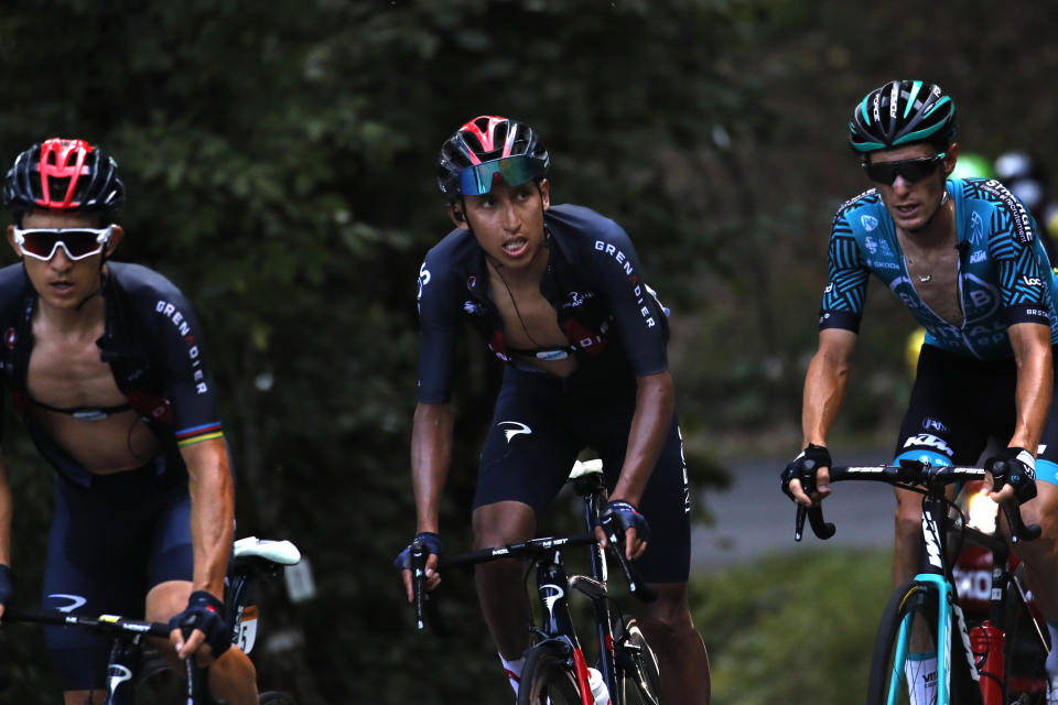 Colombia's Egan Bernal, center, climbs Grand Colombier during the stage 15 of the Tour de France cycling race over 174 kilometers (108 miles), with start in Lyon and finish in Grand Colombier, Sunday, Sept. 13, 2020. (AP Photo/Christophe Ena)