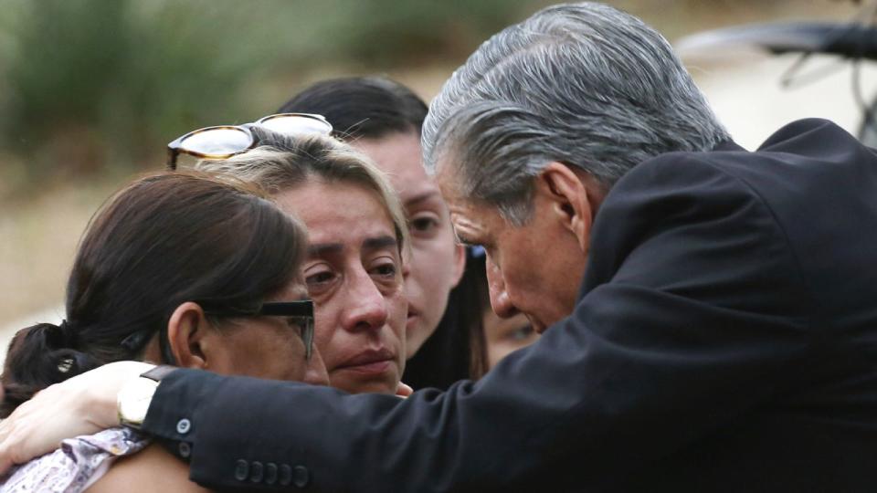 The Archbishop of San Antonio, Gustavo Garcia-Siller, comforts families outside of the Civic Center following a deadly school shooting at Robb Elementary School in Uvalde, Texas Tuesday, May 24, 2022.