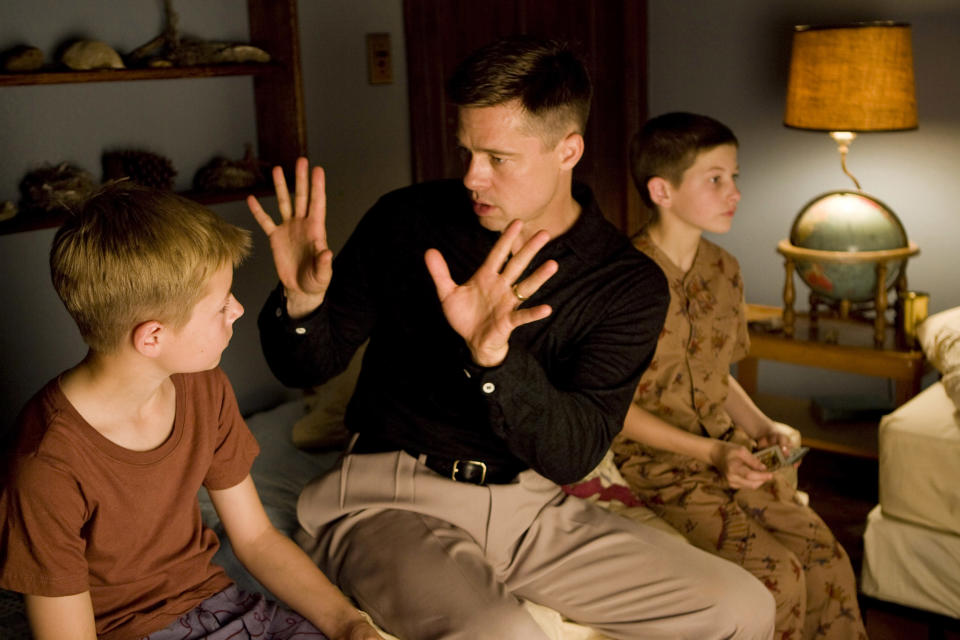 THE TREE OF LIFE, from left: Laramie Eppler, Brad Pitt, Tye Sheridan, 2011. ©Fox Searchlight/Courtesy Everett Collection