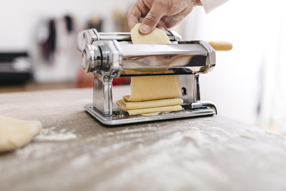 Someone using a pasta maker