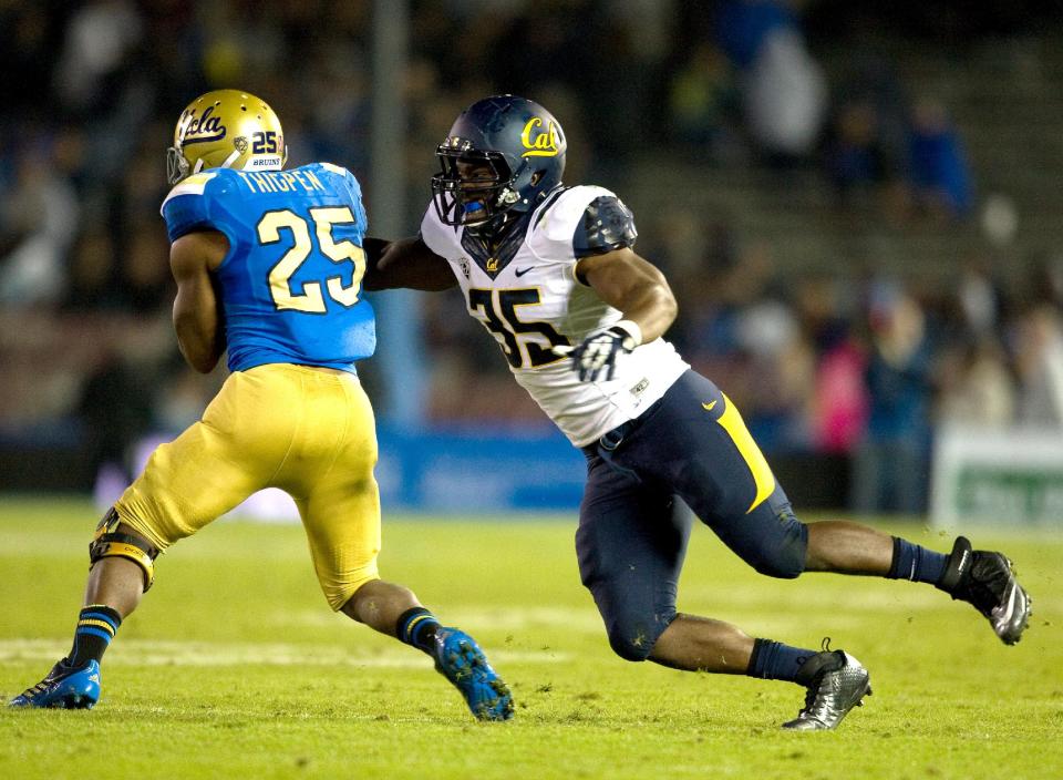 This Oct. 12, 2013 photo released by GoldenBearSports.com shows California's Ted Agu, right, tackling UCLA's Damien Thigpen, in Pasadena, Calif. Agu died Friday morning, Feb. 7, 2014. He was 21. The school announced Agu's death and said its thoughts and prayers were with Agu's family, friends and teammates. The school said it would give more information about the circumstances later. (AP Photo/GoldenBearSports.com, Michael Pimentel) MANDATORY CREDIT