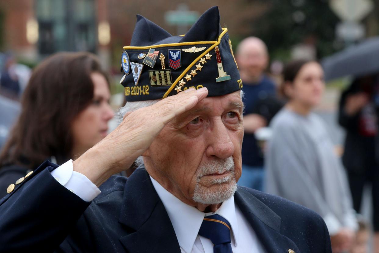 American Legion 129 member Warren E. Barney, Island Heights, salutes as the National Anthem played during the Town Hall ceremony that followed the Toms River Veteran's Day Parade Friday, November 11, 2022.  Barney is a Navy Veteran, 1958-62.