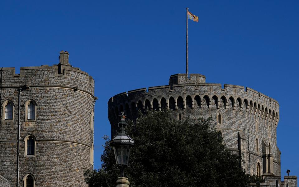The Royal Standard remained high above Windsor Castle while the Queen spent a night in hospital - AP Photo/Kirsty Wigglesworth