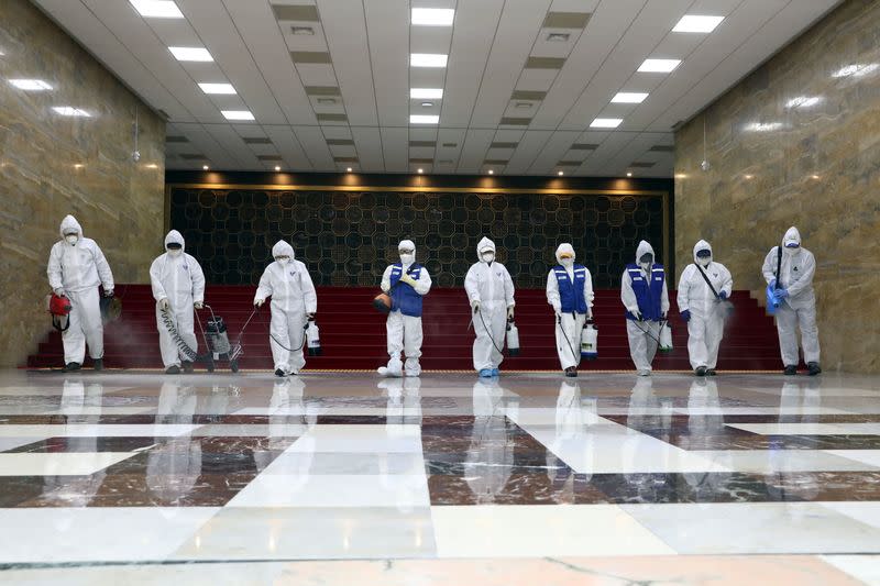 Employees from a disinfection service company sanitize the National Assembly in Seoul