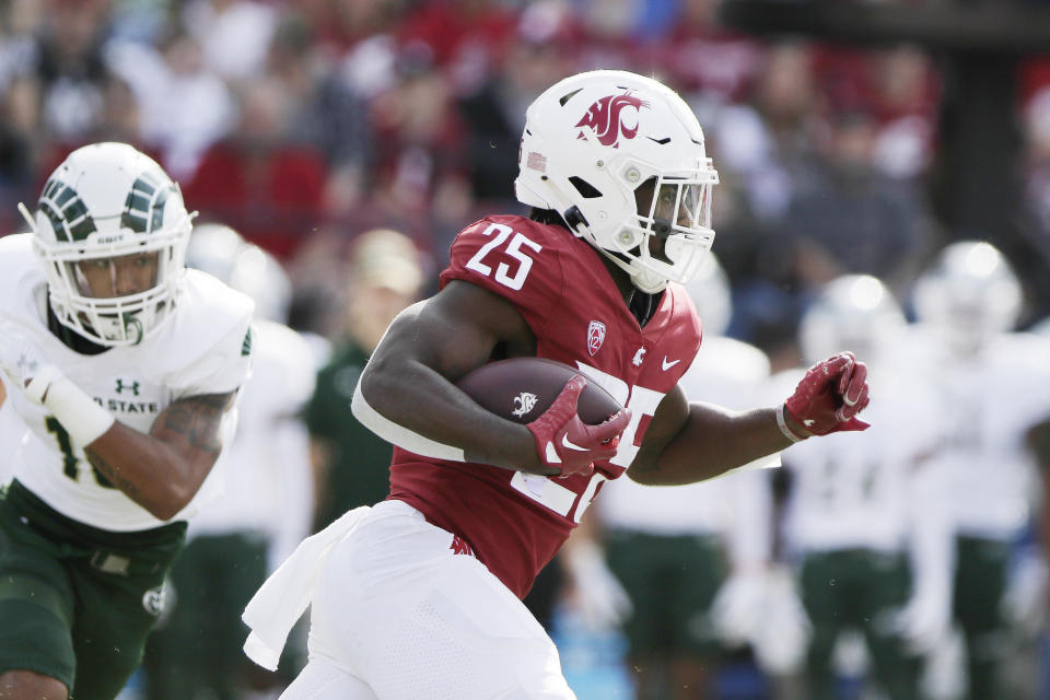 Washington State running back Nakia Watson carries the ball during the first half of an NCAA college football game against Colorado State, Saturday, Sept. 17, 2022, in Pullman, Wash. (AP Photo/Young Kwak)