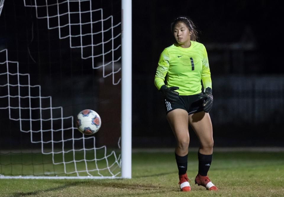 Caroline Struck's shot gets past Tigers goal keeper Kelly Rowland (1) as the Crusaders take a 1-0 lead during the Pensacola vs Catholic girls soccer game at Pensacola Catholic High School on Tuesday, Dec. 7, 2021.