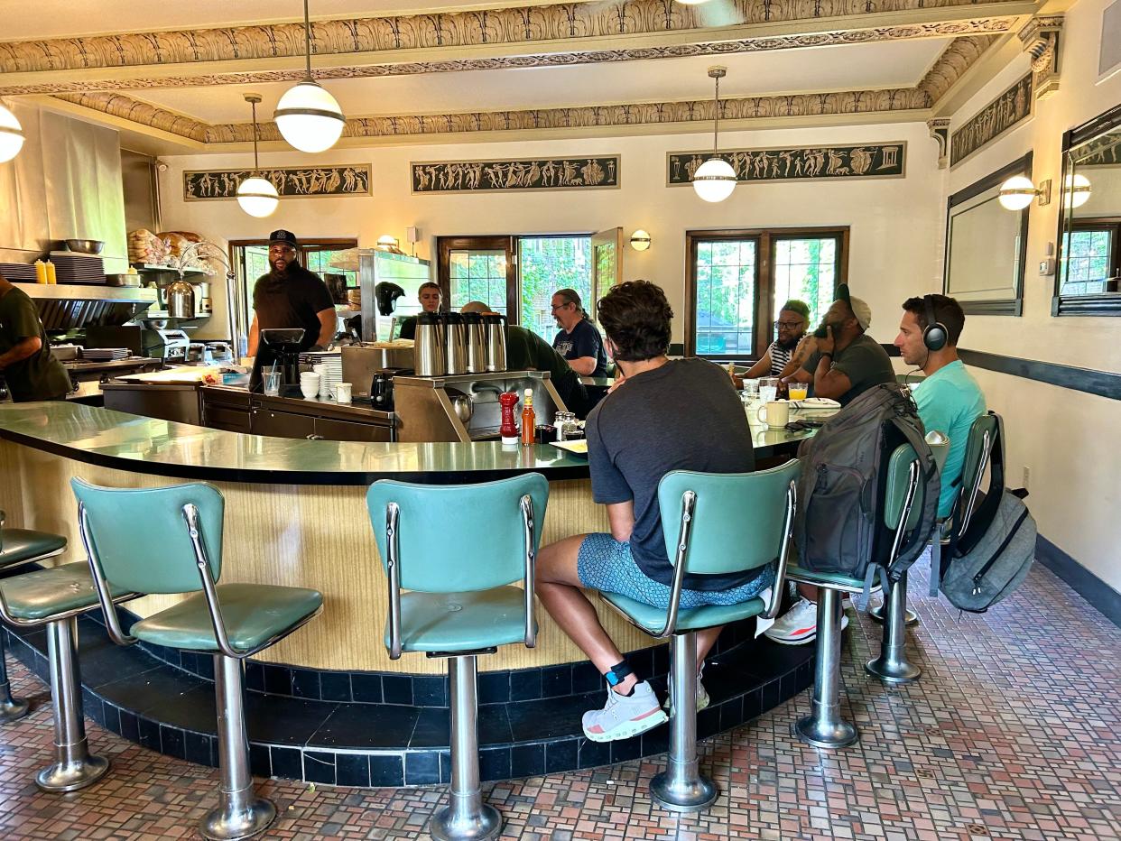 The Cafe at the Plaza's horseshoe-shaped lunch counter was installed in 1950 and has remained a staple of the cafe since.