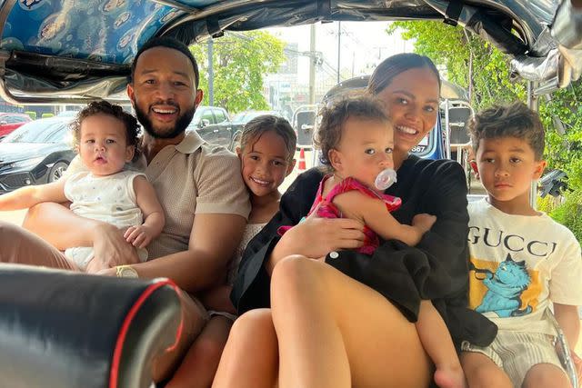 <p>Chrissy Teigen/Instagram</p> Chrissy Teigen and John Legend in Thailand with their kids