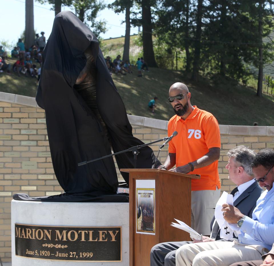 Joe Dose, the grandson of Marion Motley, speaks during un unveiling of his grandfather's statue in Canton on Wednesday, August 3, 2022.