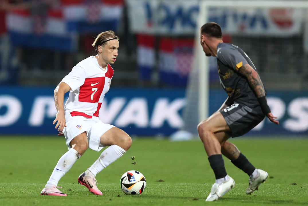 RIJEKA, CROATIA - JUNE 3: Lovro Majer tries to pass the player of the North Macedonia during an International Friendly match between Croatia and North Macedonia at Stadion HNK Rijeka on June 3, 2024 in Rijeka, Croatia.  (Photo by Matija Habljak/Pixsell/MB Media/Getty Images)