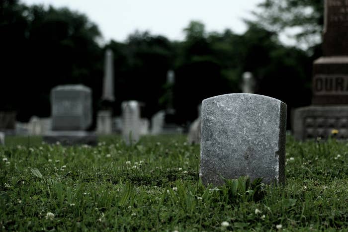 A gravestone in a cemetery