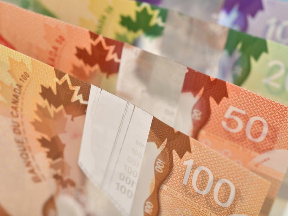 Close up of Canadian banknotes (CAD) background