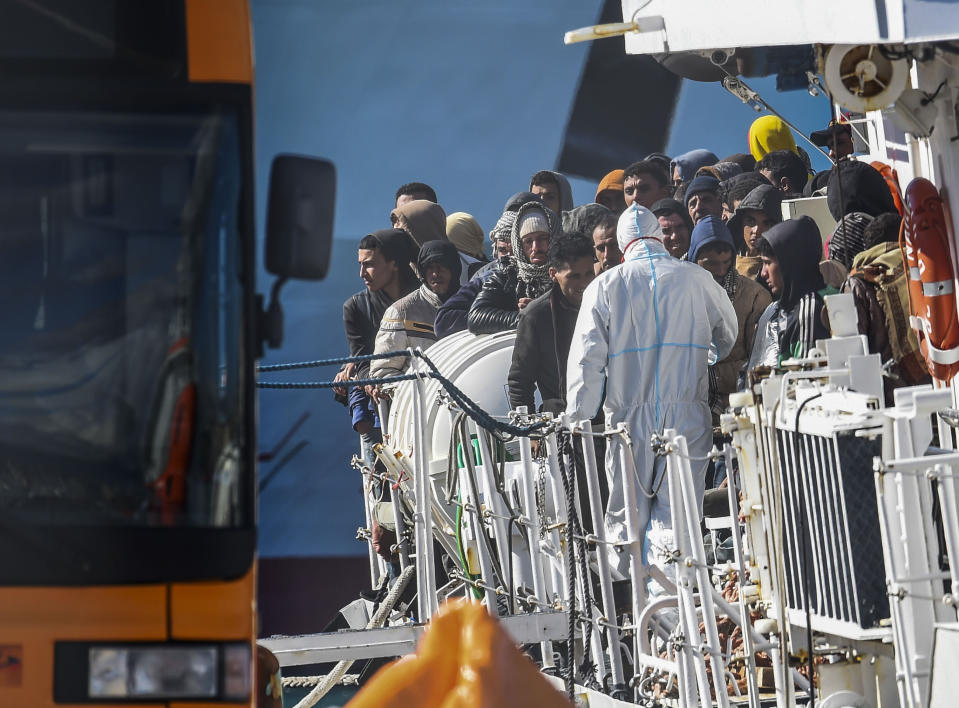 Some 300 migrants are disembarked from the Italian coast guard ship Peluso in the Sicilian harbor of Catania, Italy, Monday, April 17, 2023. (AP Photo/Salvatore Cavalli)