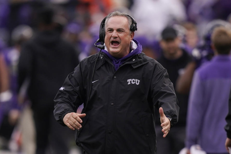 FILE - TCU head coach Sonny Dykes cheers after his team scored during the first half of an NCAA college football game against Iowa State in Fort Worth, Texas, Saturday, Nov. 26, 2022. TCU's Sonny Dykes won The Associated Press Coach of the Year on Monday, Dec. 19, after leading the No. 3 Horned Frogs to the College Football Playoff in his first season with the school.(AP Photo/LM Otero, File)