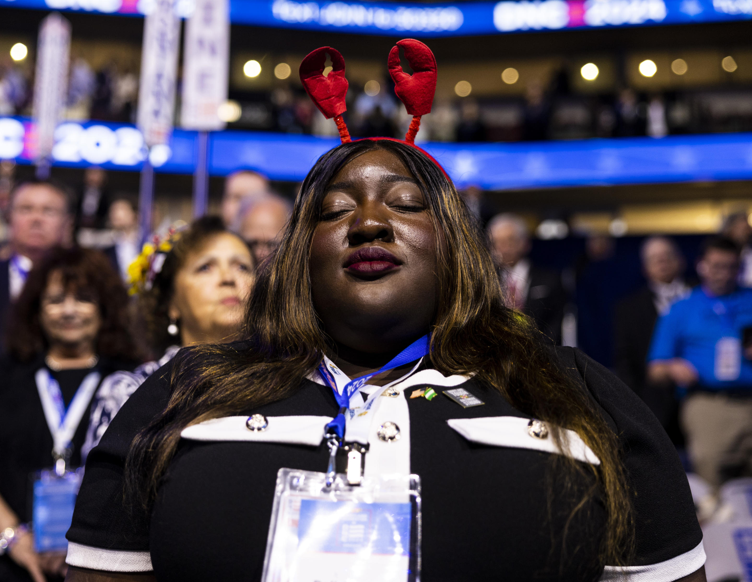 A delegate from Maryland takes part in a prayer during the first day of the the Democratic National Convention in Chicago. (Aude Guerrucci/Maxppp via ZUMA Press)