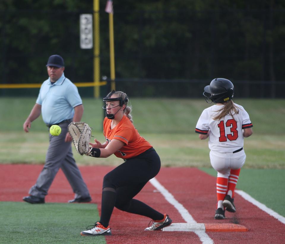 Marlboro's Kalista Birkenstock makes it to first base passed Wellsville's Marissa Ordway during the New York State Softball Championship semifinal on June 9, 2023. 