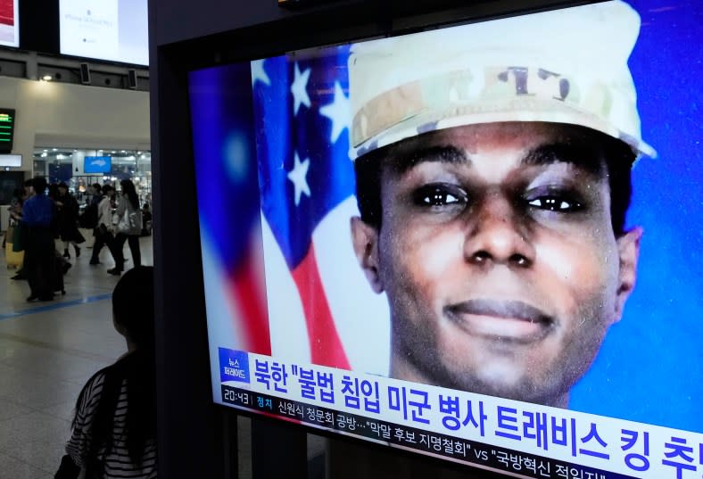 A TV screen shows a file image of American soldier Travis King during a news program at the Seoul Railway Station in Seoul, South Korea, Wednesday, Sept. 27, 2023. (AP Photo/Ahn Young-joon)