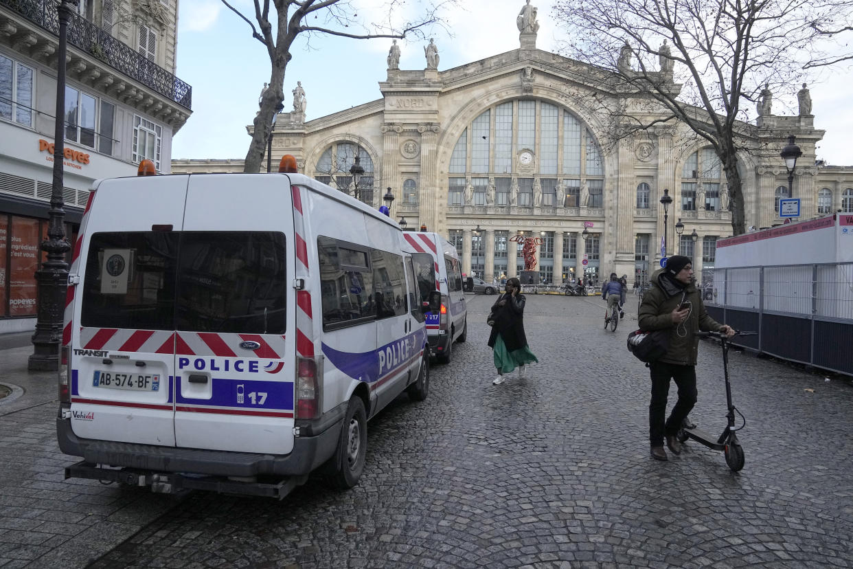 A police car parks outside the Gare du Nord train station, Wednesday, Jan. 11, 2023 in Paris. (AP Photo/Michel Euler)