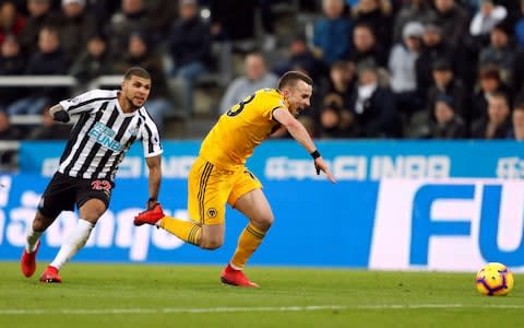 Newcastle United's DeAndre Yedlin fouls Wolverhampton Wanderers' Diogo Jota resulting in a red card being shown  - Credit: Action Images via Reuters/Lee Smith 