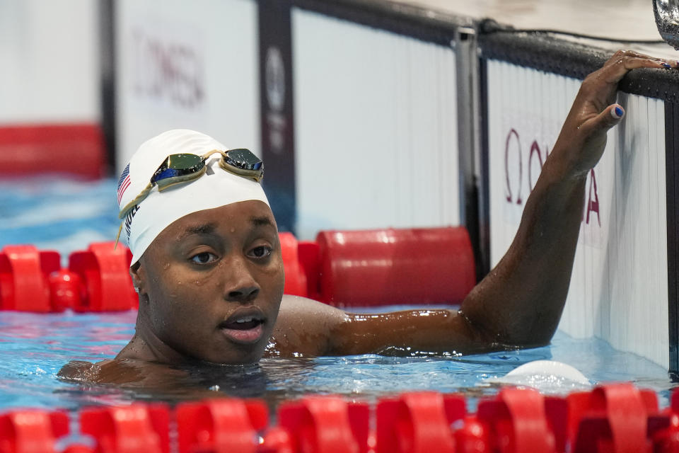 Simone Manuel, of United States, finishes a women's 50-meter freestyle heat at the 2020 Summer Olympics, Friday, July 30, 2021, in Tokyo, Japan. (AP Photo/David Goldman)