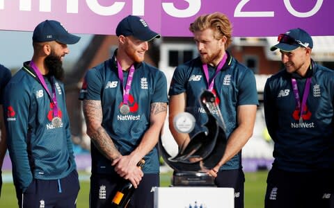 David Willey with Ben Stokes and Moeen Ali after the game - Credit: Reuters