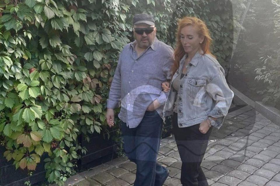 A new photo posted to Telegram appeared to show Sergei Surovikin with a woman resembling his wife (via REUTERS)