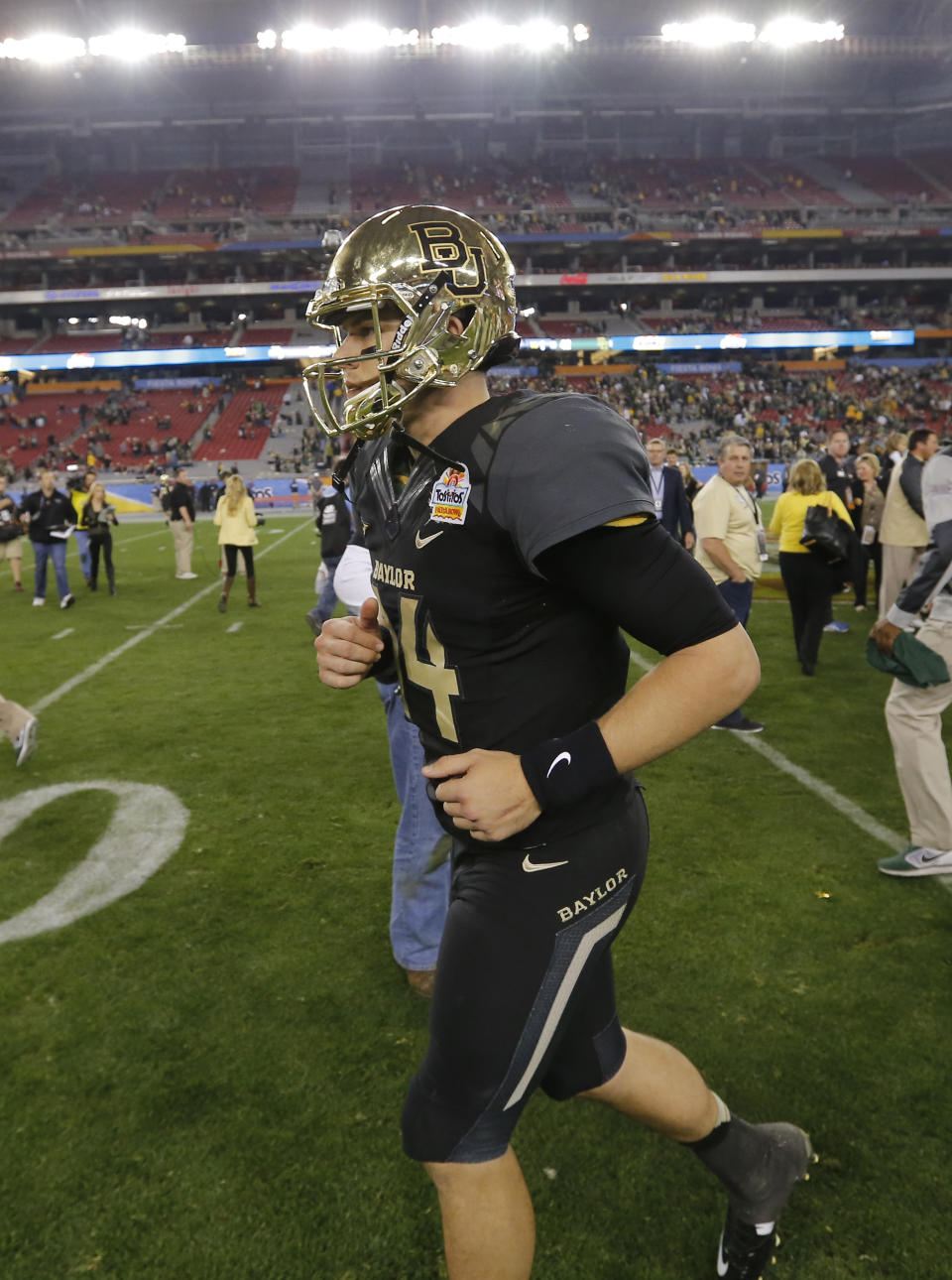 Baylor quarterback Bryce Petty (14) leaves the field after the Fiesta Bowl NCAA college football game, Wednesday, Jan. 1, 2014, in Glendale, Ariz. Central Florida won 52-42. (AP Photo/Matt York)