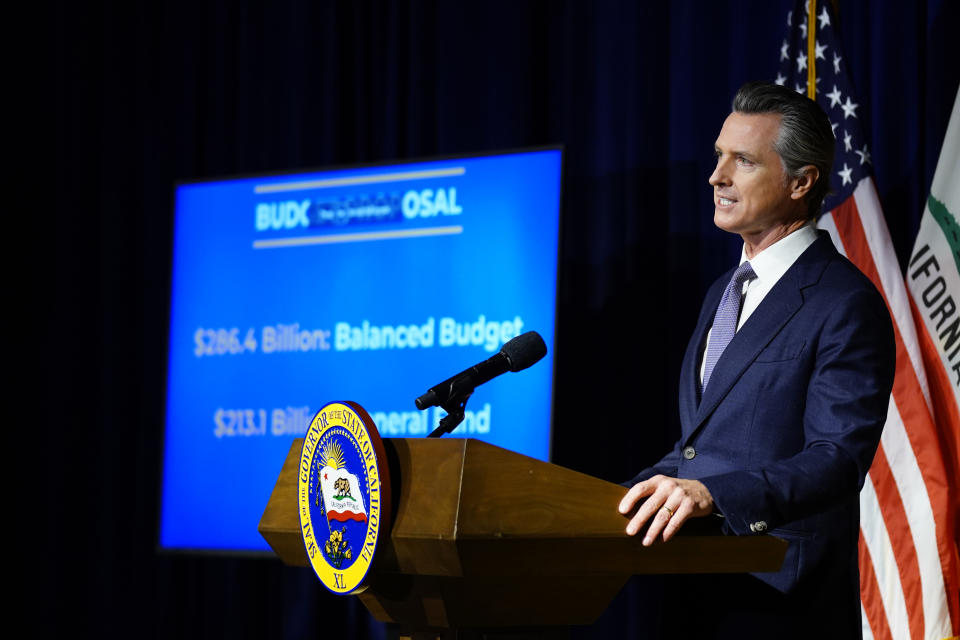 California Gov. Gavin Newsom unveils his proposed 2022-2023 state budget during a news conference in Sacramento, Calif., Monday, Jan. 10, 2022. (AP Photo/Rich Pedroncelli)