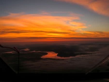 Picture taken by Swiss adventurer Andre Borschberg onboard Solar Impulse 2 (Si2) during the flight from Tusla/OK to Dayton/OH shows the Mississippi river at sunset, May 21, 2016. Andre Borschberg, Jean Revillard, Christophe Chammartin/SI2/Handout via Reuters