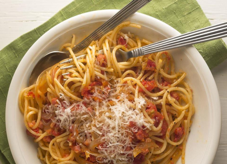 <p>Revered by some as one of the most famous pasta dishes in Rome, Spaghetti all'Amatriciana is set apart from the rest by guanciale (cured pork jowl). If the ingredient isn’t available near you, thinly sliced bacon will do the trick.</p> <p><a href="https://www.thedailymeal.com/recipes/spaghetti-allamatriciana-recipe-0?referrer=yahoo&category=beauty_food&include_utm=1&utm_medium=referral&utm_source=yahoo&utm_campaign=feed" rel="nofollow noopener" target="_blank" data-ylk="slk:For the Spaghetti all'Amatriciana recipe, click here.;elm:context_link;itc:0;sec:content-canvas" class="link ">For the Spaghetti all'Amatriciana recipe, click here.</a></p>