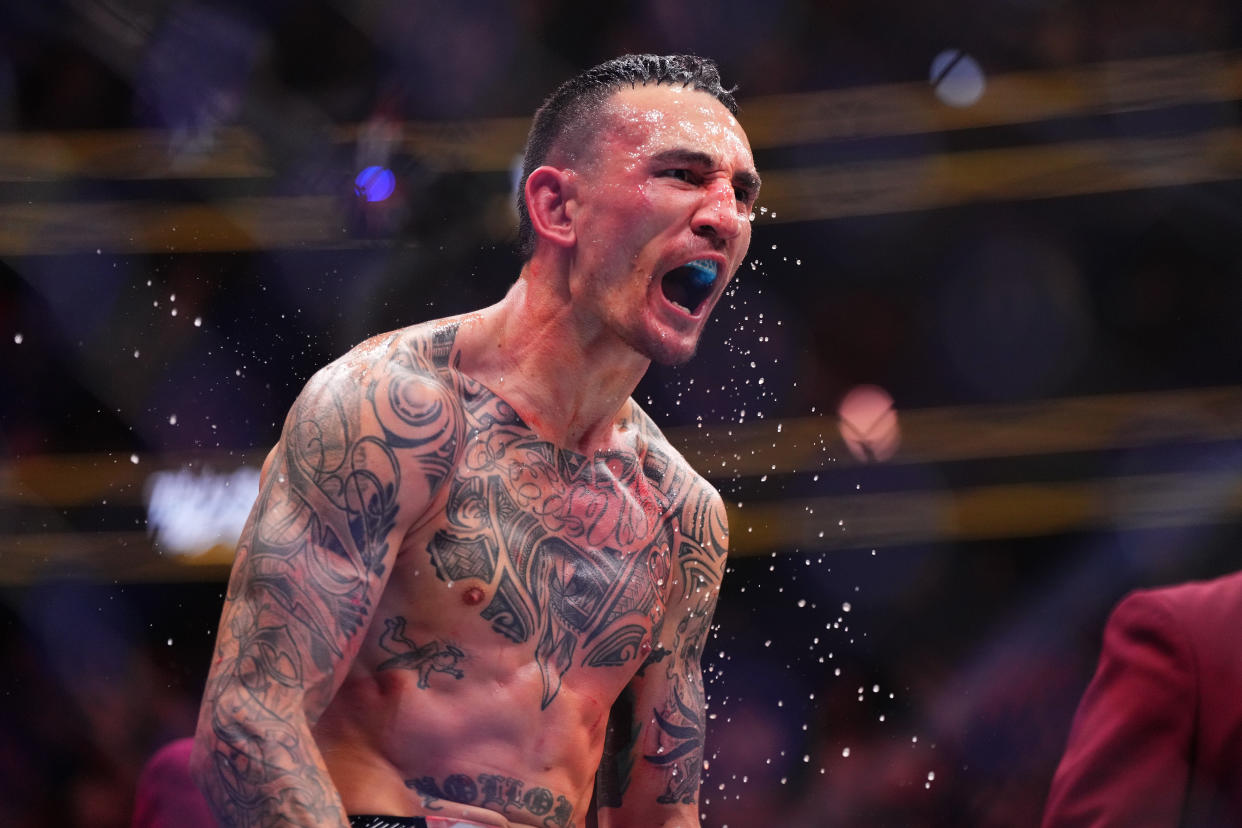 LAS VEGAS, NEVADA - APRIL 13: Max Holloway reacts to his knockout of Justin Gaethje in the BMF championship fight during the UFC 300 event at T-Mobile Arena on April 13, 2024 in Las Vegas, Nevada.  (Photo by Cooper Neill/Zuffa LLC via Getty Images)