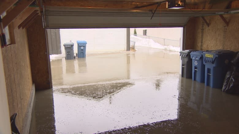 Homeowner says 9 days for city to respond to flooded back lane unacceptable