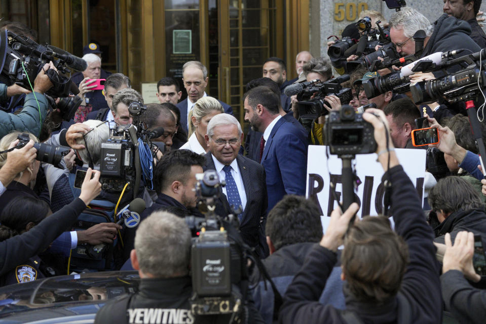 Sen. Bob Menendez and his wife, Nadine Menendez, leave federal court, Wednesday, Sept. 27, 2023, in New York. Menendez pled not guilty to federal charges alleging he used his powerful post to secretly advance Egyptian interests and carry out favors for local businessmen in exchange for bribes of cash and gold bars.(AP Photo/Jeenah Moon)