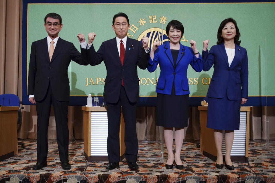 FILE - In this Sept. 18, 2021, file photo, candidates for the presidential election of the ruling Liberal Democratic Party pose prior to a debate session hosted by the Japan National Press Club in Tokyo. The stakes are high as Japanese governing party members vote Wednesday, Sept. 29, 2021 for the four candidates seeking to replace Yoshihide Suga as prime minister. The next leader must address a pandemic-battered economy, a newly empowered military operating in a dangerous neighborhood, crucial ties with an inward-focused ally, Washington, and tense security standoffs with an emboldened China and its ally North Korea. (AP Photo/Eugene Hoshiko, Pool, File)