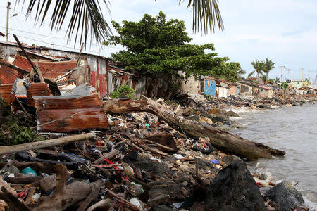 Debris is piled up next to the houses on the seashore in the aftermath of Hurricane Irma in Puerto Plata, Dominican Republic, September 8, 2017. REUTERS/Ricardo Rojas