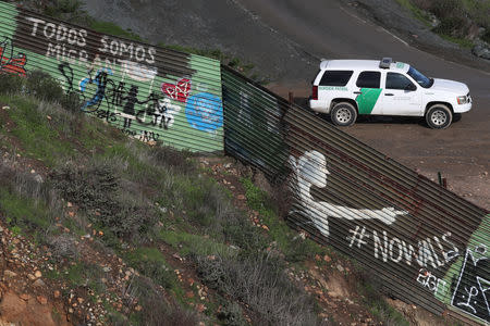 A United States Border Patrol vehicle sits near the border fence between Mexico and the U.S., in Tijuana, Mexico, January 18, 2019. REUTERS/Shannon Stapleton