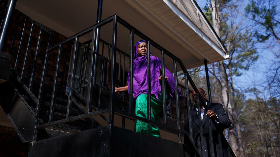 Habibo Mohamed and her husband Abdalla Ramadhan Munye climb the stairs to their apartment in Clarkston, Georgia, in February 2017. - Melissa Golden/Redux