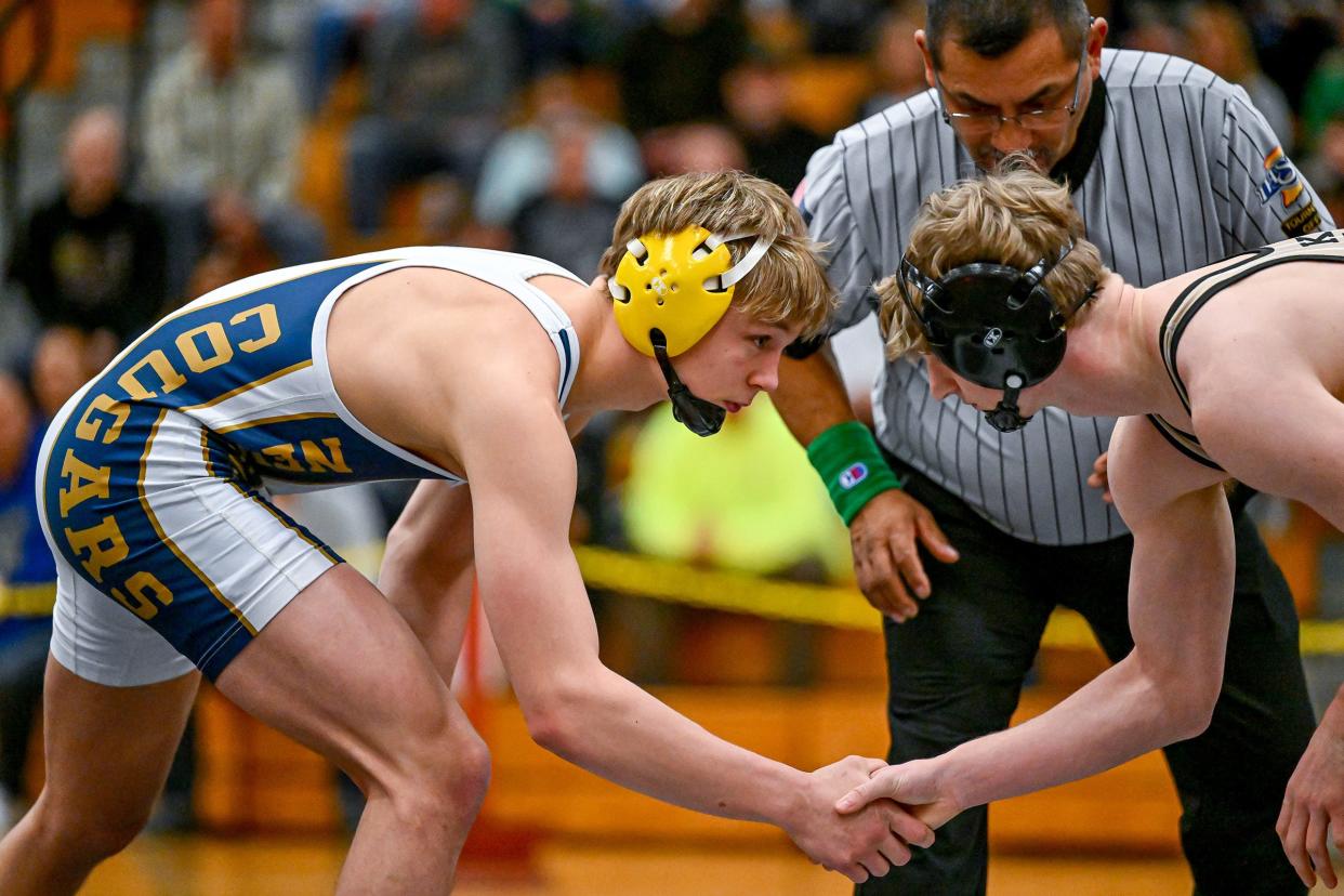 New Prairie’s Jeffrey Huyvaert, left, prepares to wrestle Penn’s Wesley Harper in the 138 lb. championship Saturday, Jan. 14, 2023, at Elkhart High School. Huyvaert won.