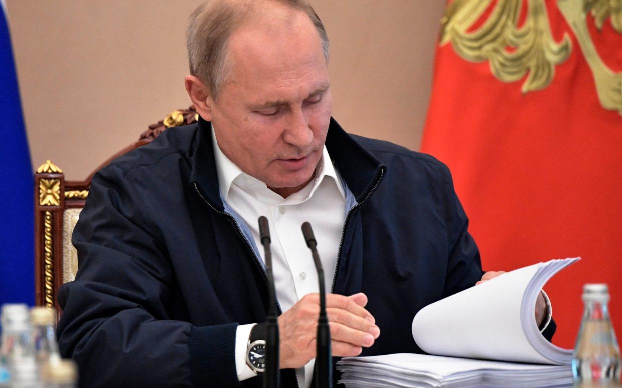 Vladimir Putin is seen preparing for his annual call-in show - Pool Sputnik Kremlin