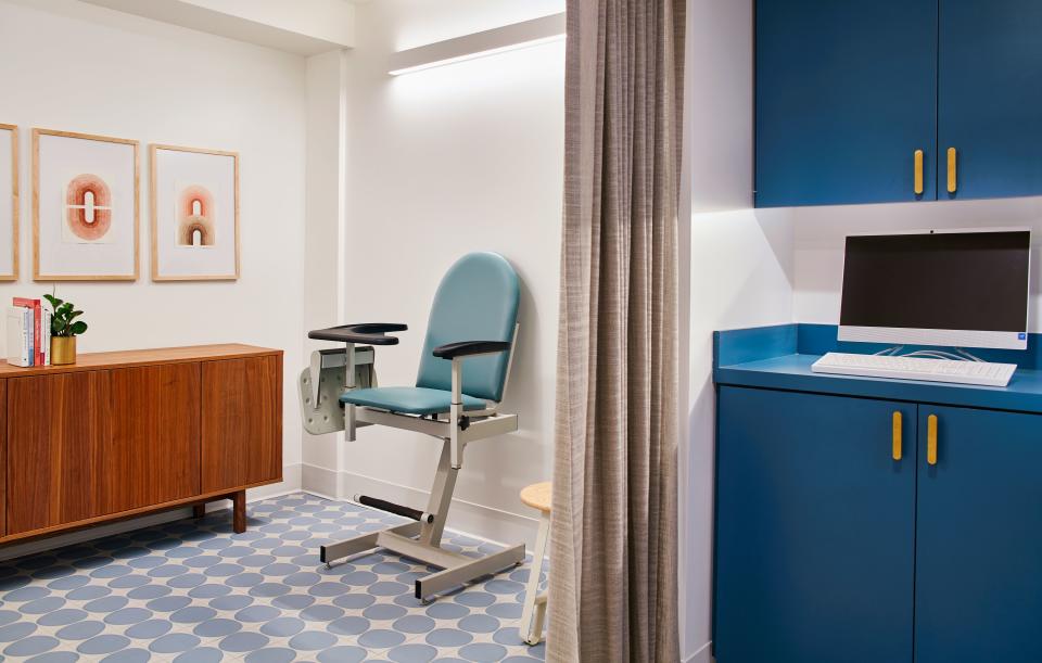 The often-feared blood-draw room is decorated with ocean blue cabinetry and tiles, and warm wood furniture to echo the local Southern California environment.