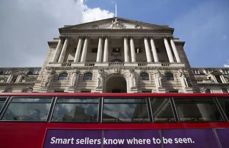 A bus passes the Bank of England in London, Britain April 28, 2015. REUTERS/Neil Hall